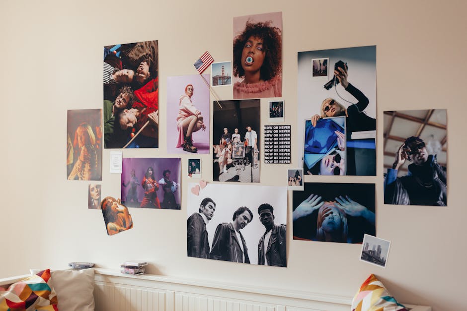 A creative photo collage decorates a room wall, featuring diverse and vibrant portraits.